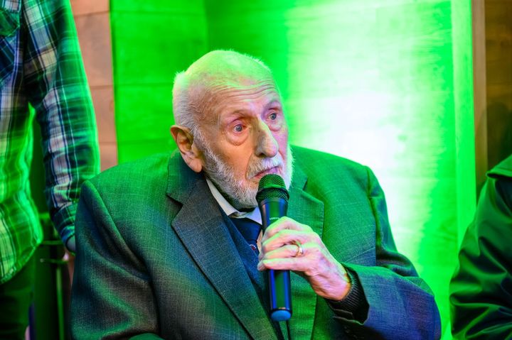 Mike Lowe speaking into a microphone at the unveiling.