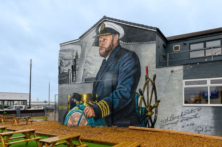 The finished mural on the Master Mariner with picnic benches in the beer garden.